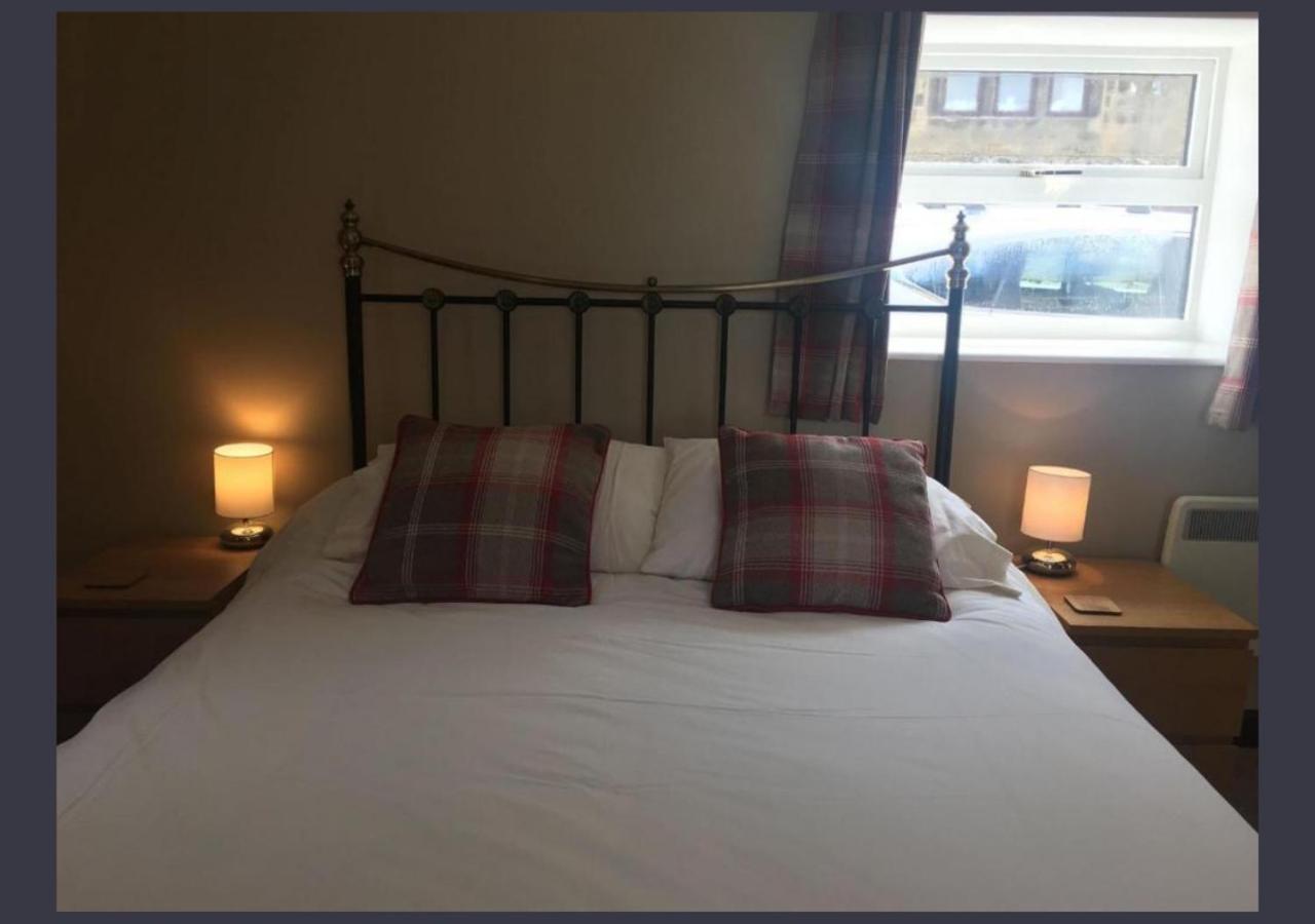 Double bedroom with warm bedside lighting